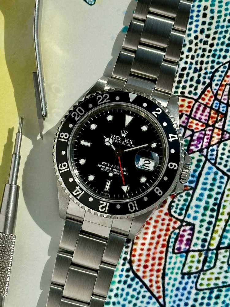 Featured image for Rolex GMT-Master "Swiss" 16700 Black 1998 with original box and papers