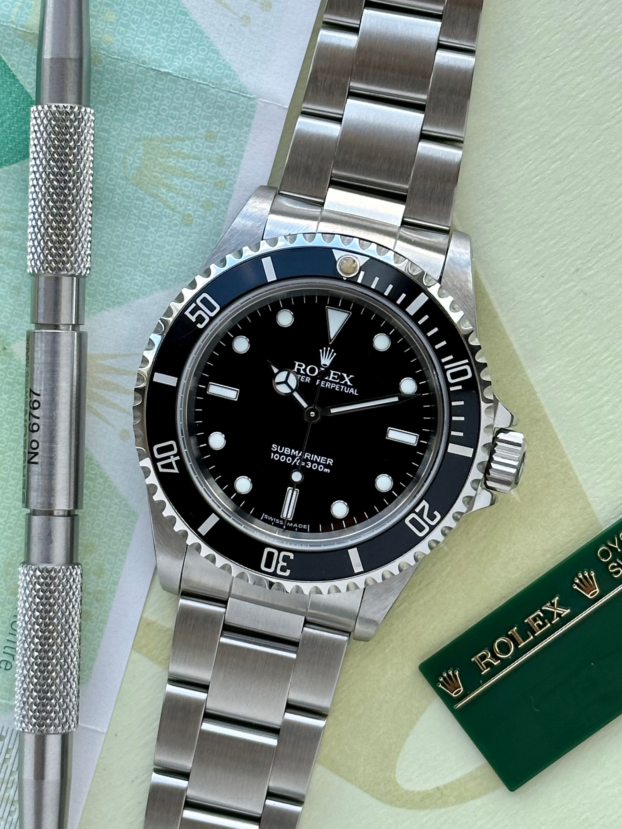 Rolex Submariner 14060M Black 2005 with original box and papers