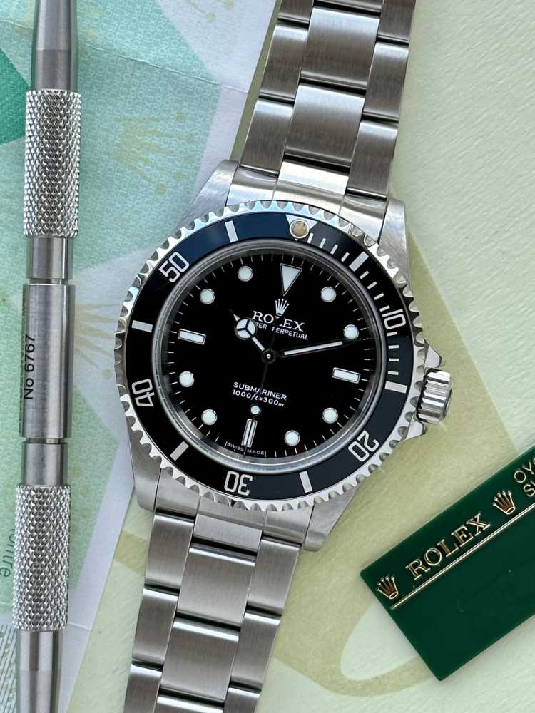 Current image for Rolex Submariner 14060M Black 2005 with original box and papers