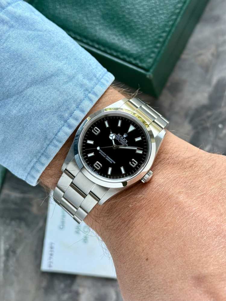 Wrist shot image for Rolex Explorer 114270 Black 2004 with original box and papers 2