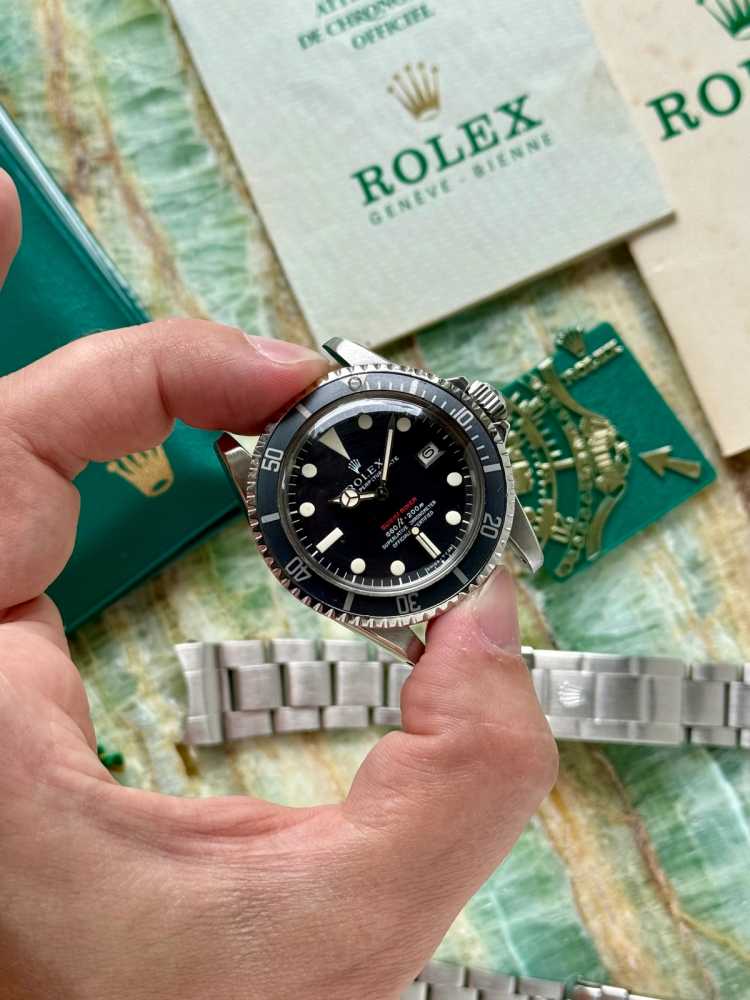 Wrist shot image for Rolex Submariner "Red" 1680 Black 1973 with original box and papers