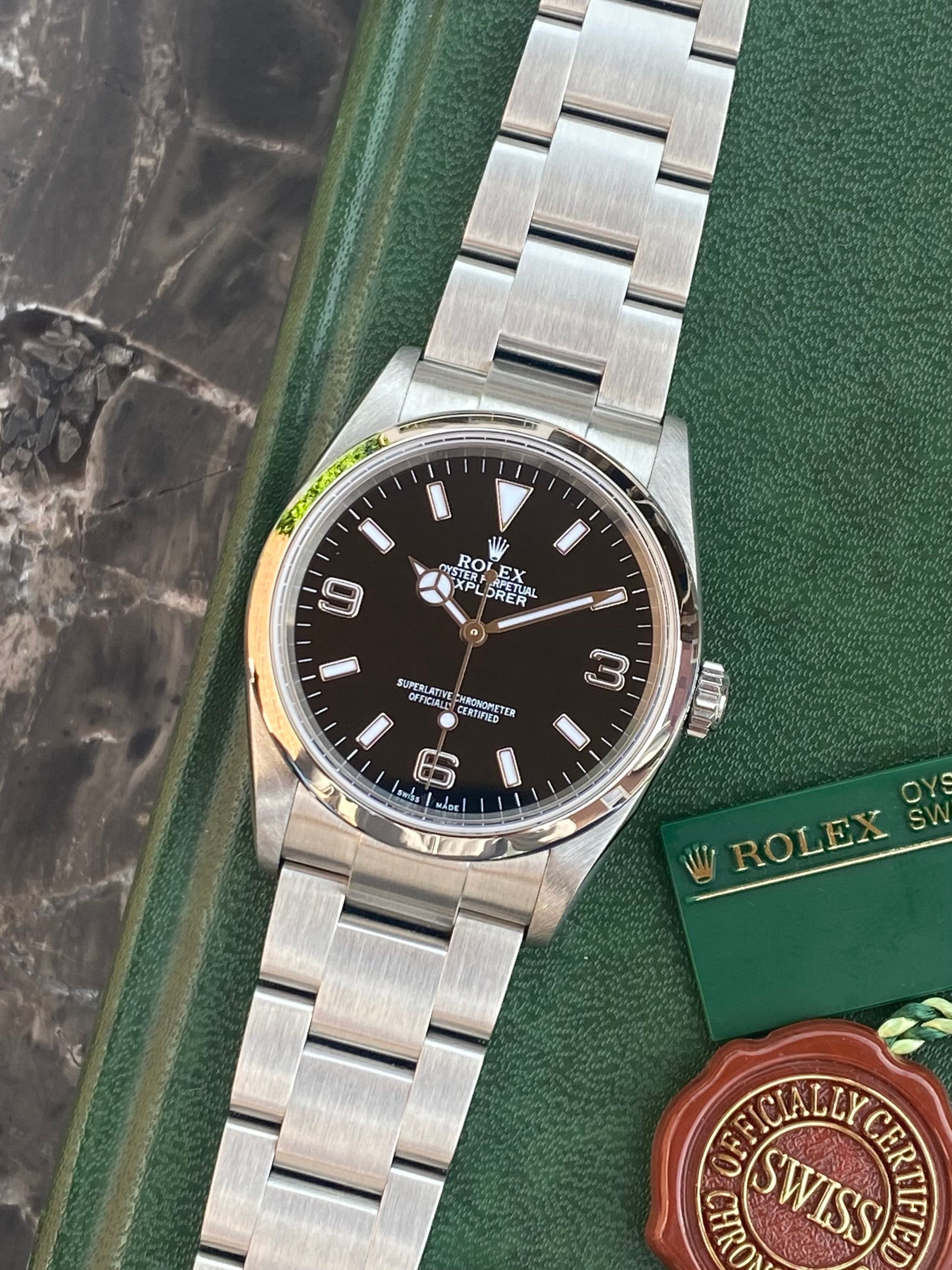 Rolex Explorer I 114270 Black 2004 with original box and papers