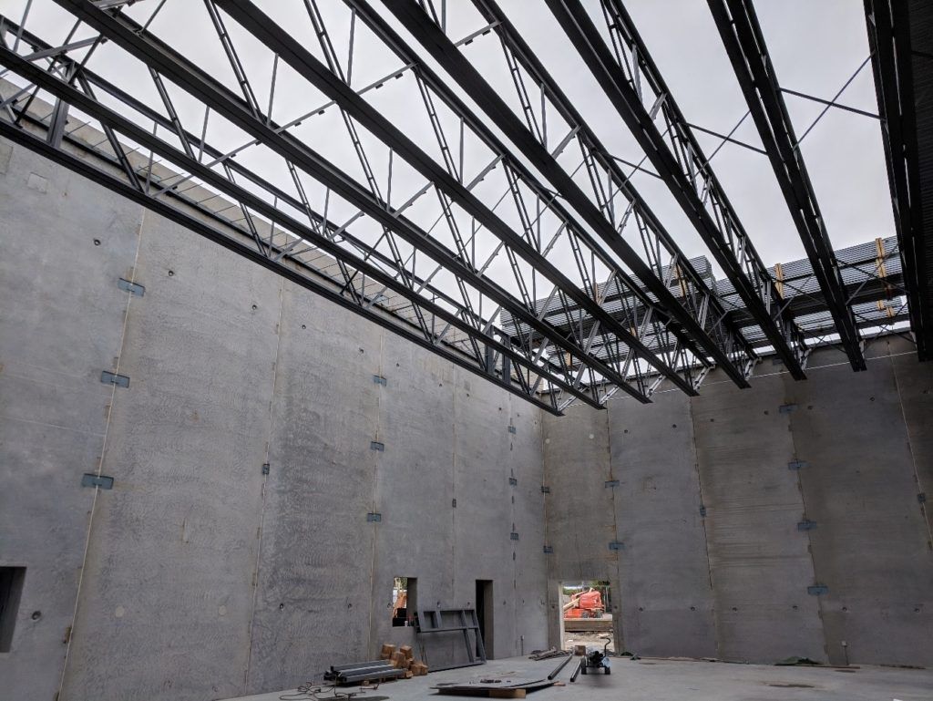 Long-span steel joists comprise the roof framing for the gymnasium, which doubles as a storm shelter per ICC 500-2014.