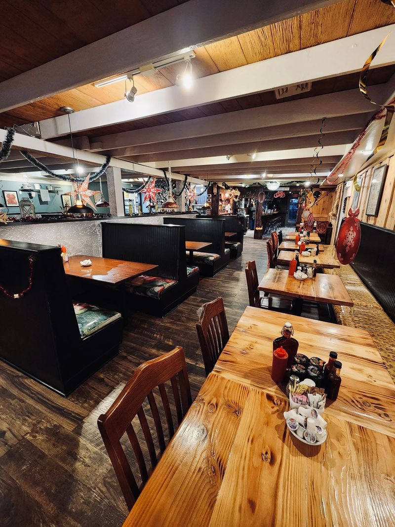 Cozy dining room with rustic wood tables & booths