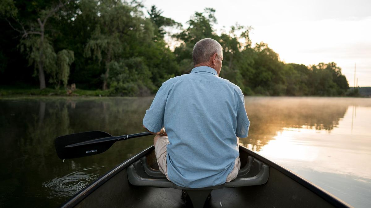A photo of a man in a canoe