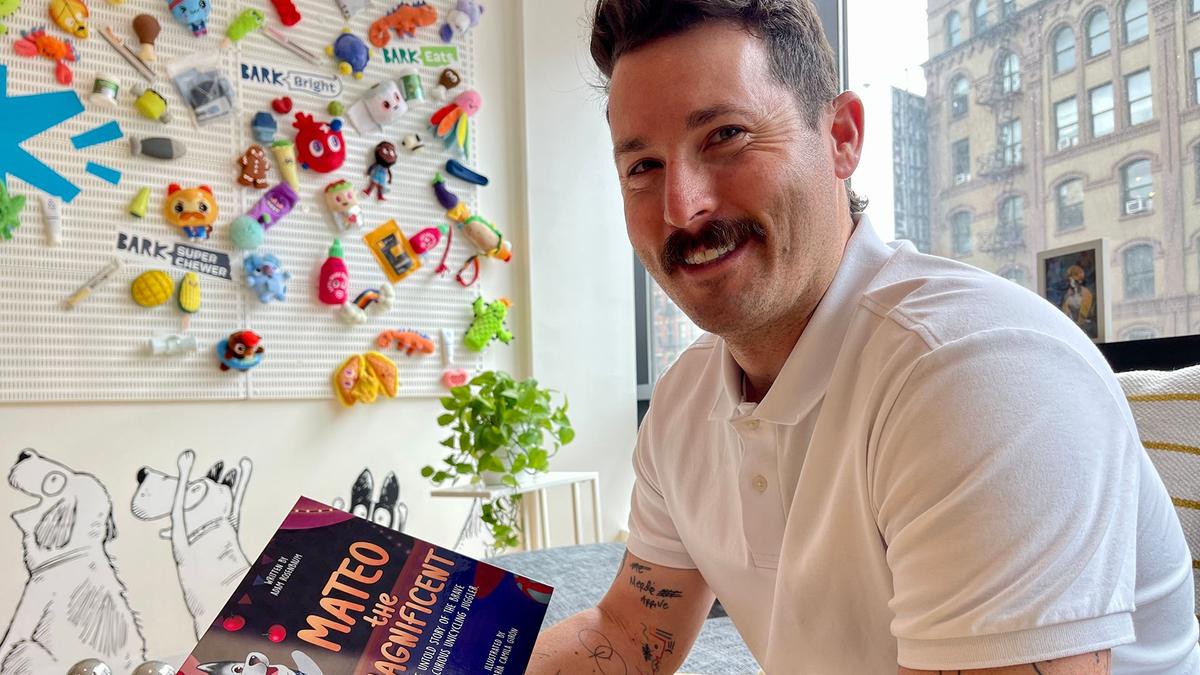 Mo Bro Adam Rosenbaum holds the children's book he's written entitled "Mateo the Magnificent" 