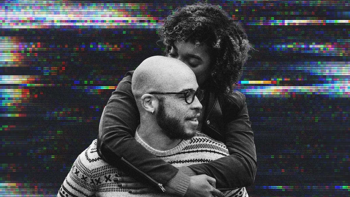 A couple with their arms around one another.