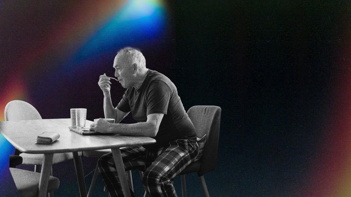 A man eating breakfast alone.