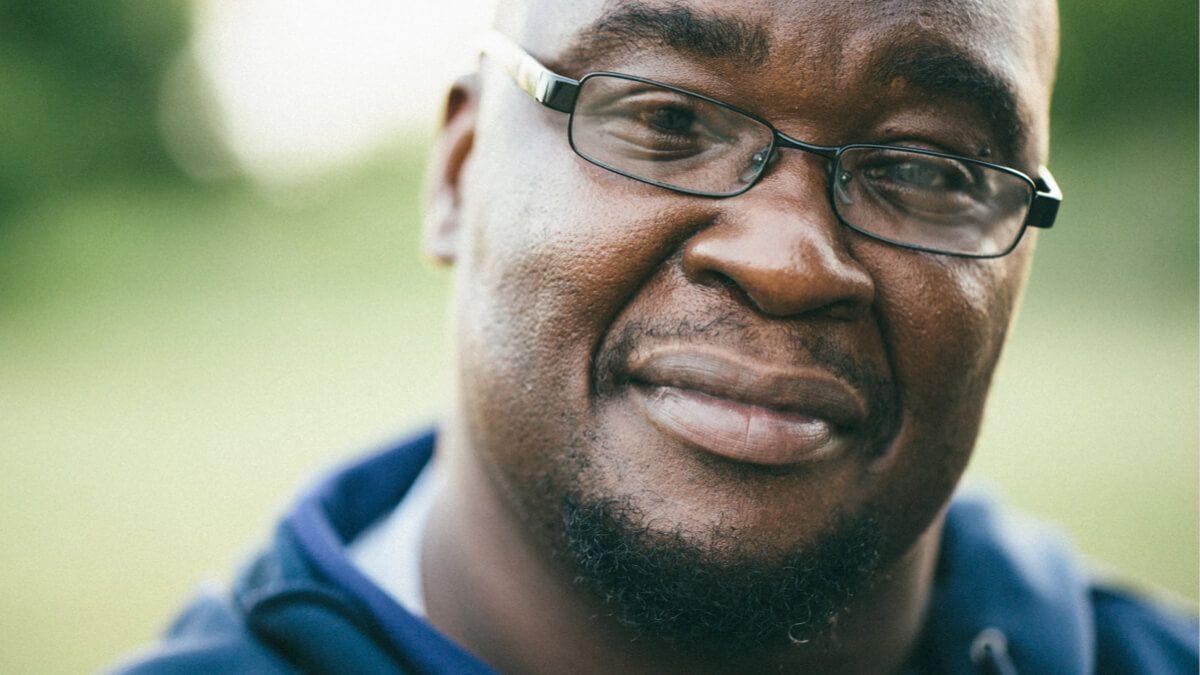 Close-up of a middle-aged Black man wearing glasses