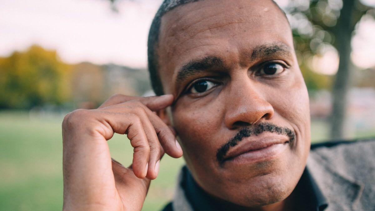 Close up of Black man with moustache
