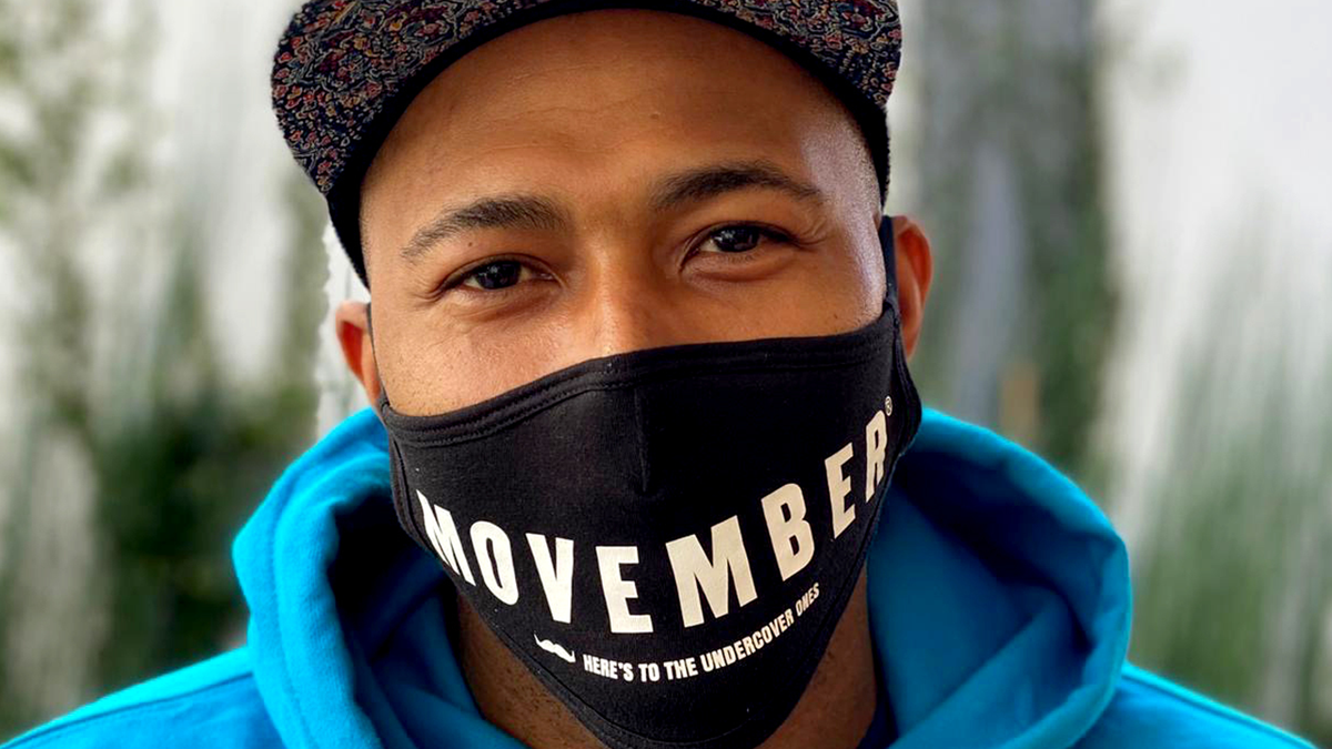 man wearing movember mask