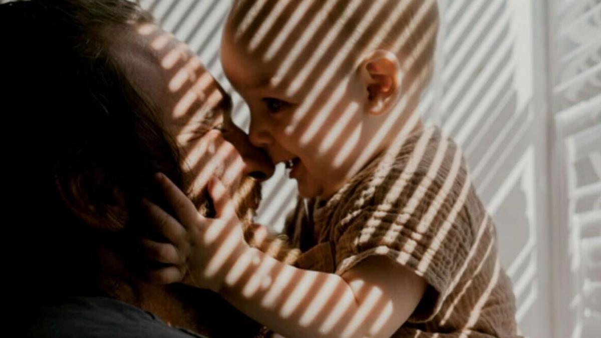An image of a father with his infant son.