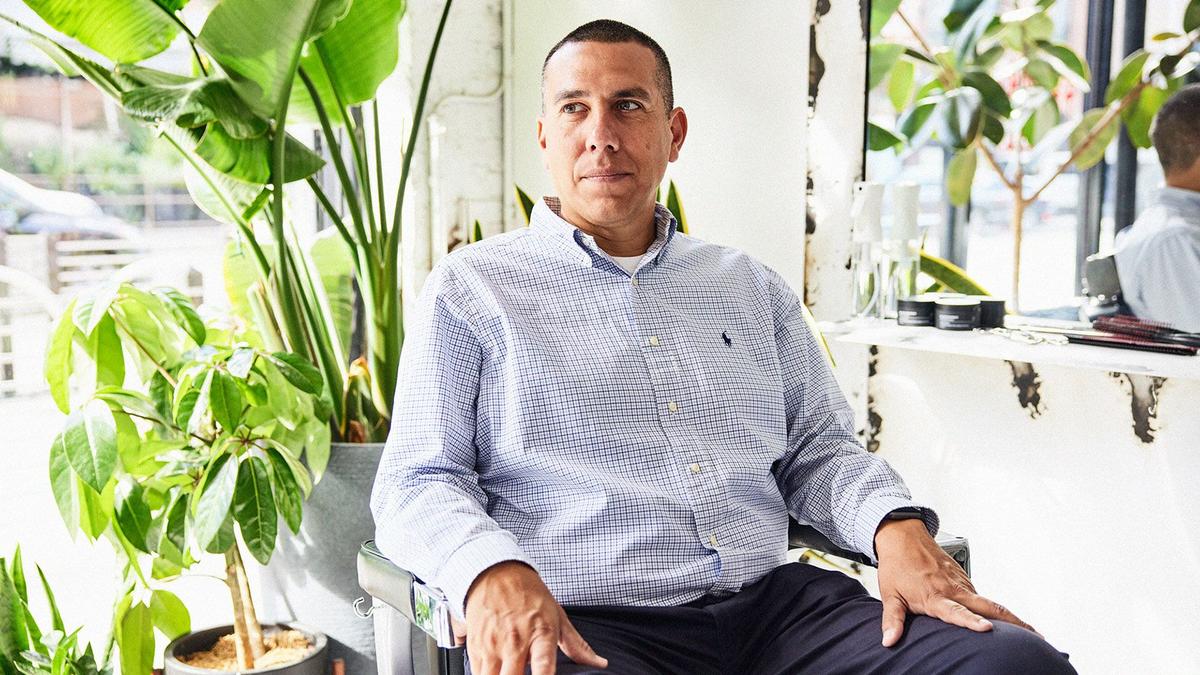The Co-founder of a Movember-funded program sits in a Chicago-based barbershop chair. 