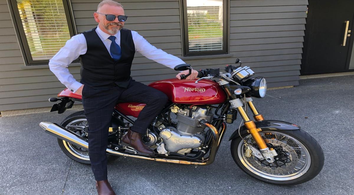 Andy Burchall alongside his Norton Motorcycle.
