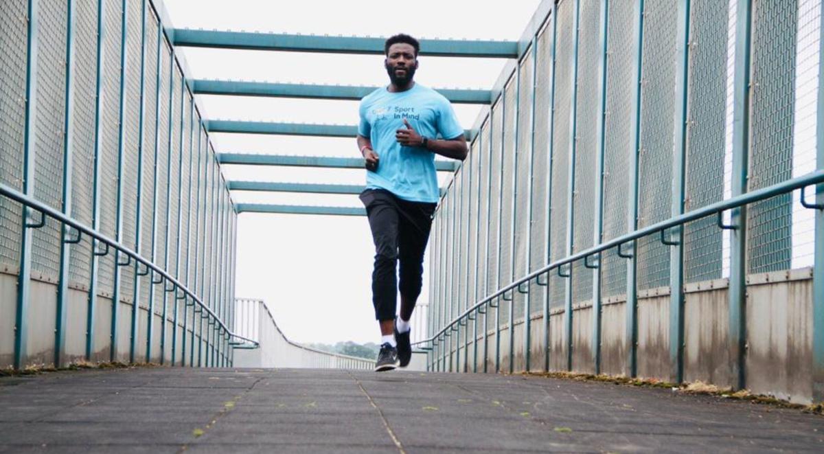 Man running over a bridge
