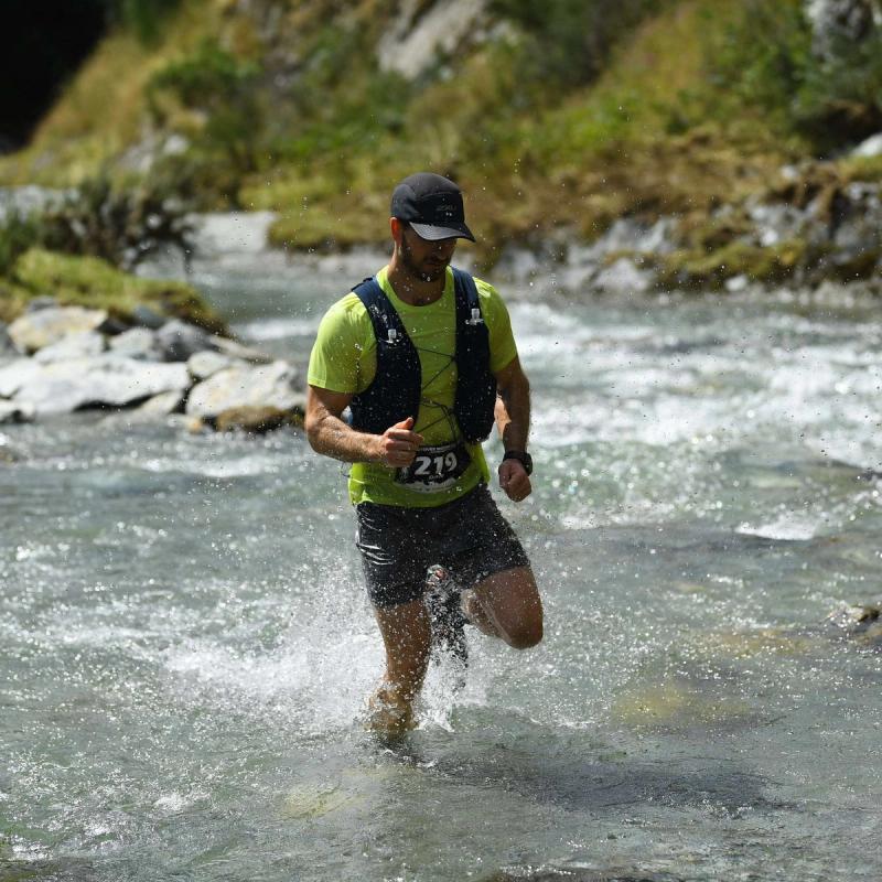 Man running through water trying to get fitter 