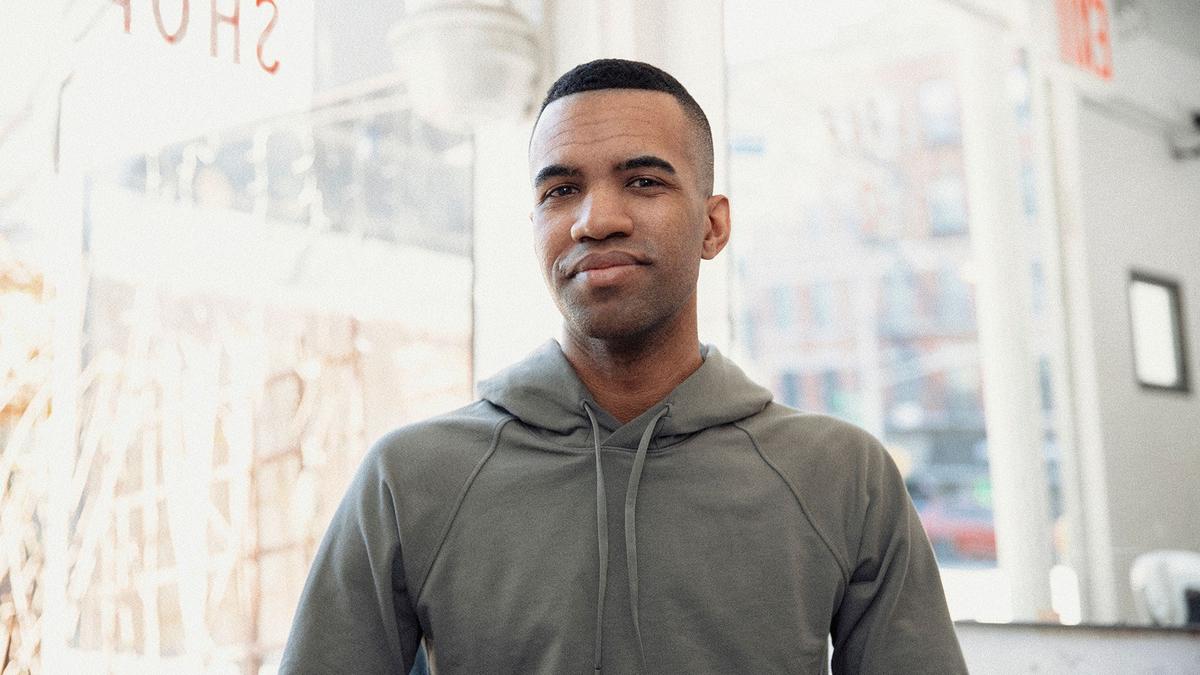 Man smiles from a barbershop
