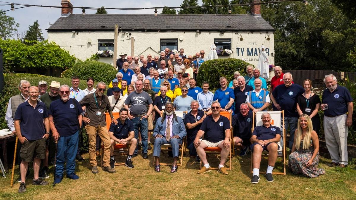 Group of guys and Movember founder at the Men's Shed