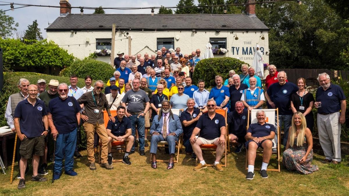 Group of guys and Movember founder at the Men's Shed
