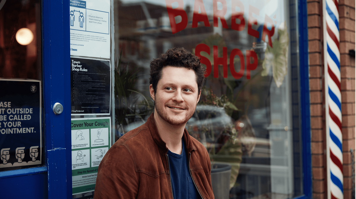 Noah Reid outside of barbershop