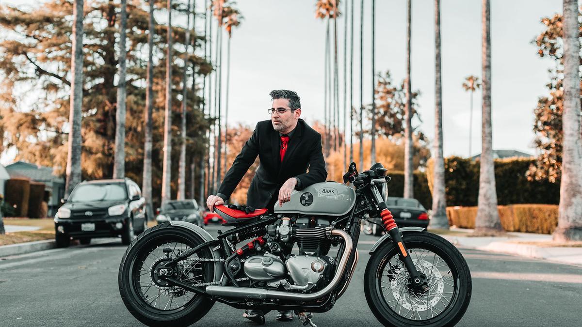 Man poses in LA with motorcycle