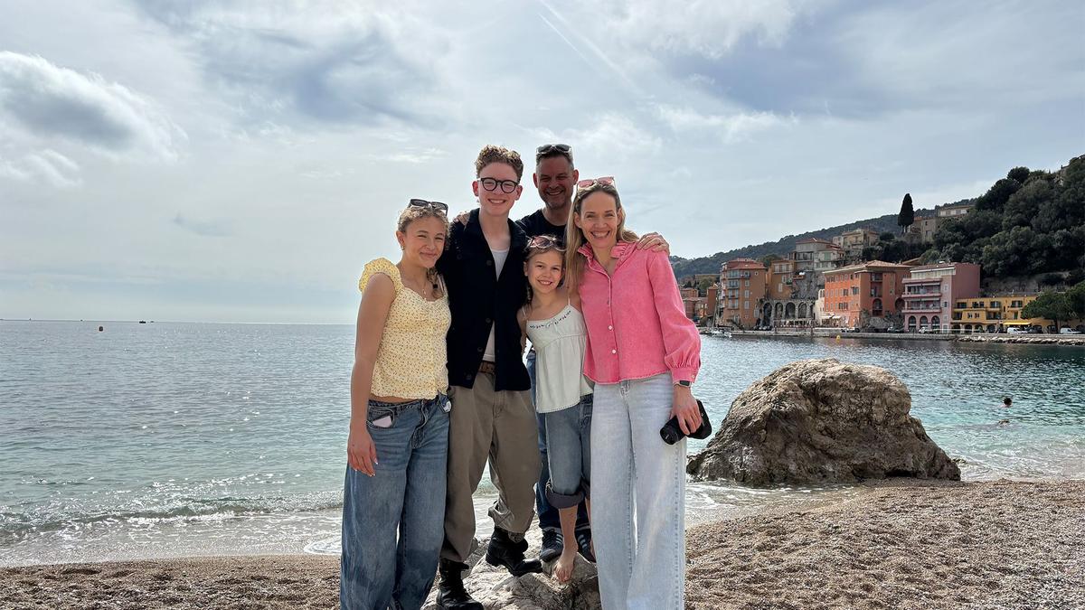 A family posing together at a beach in Vancouver