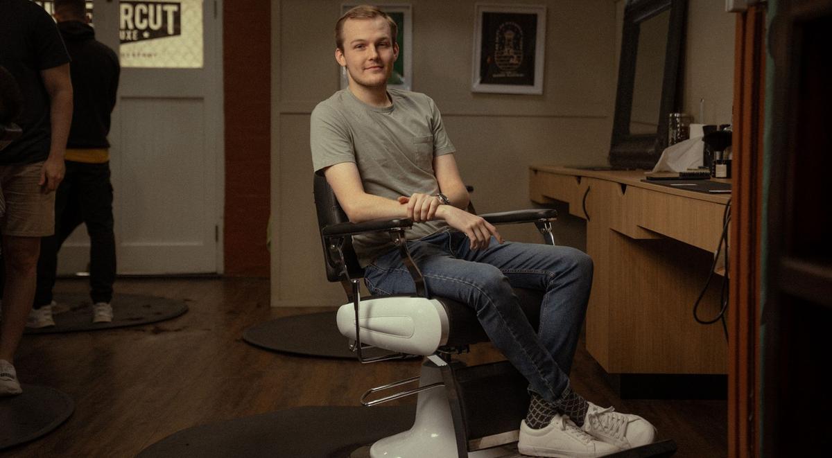 Brayden shares his story in the barber chair.