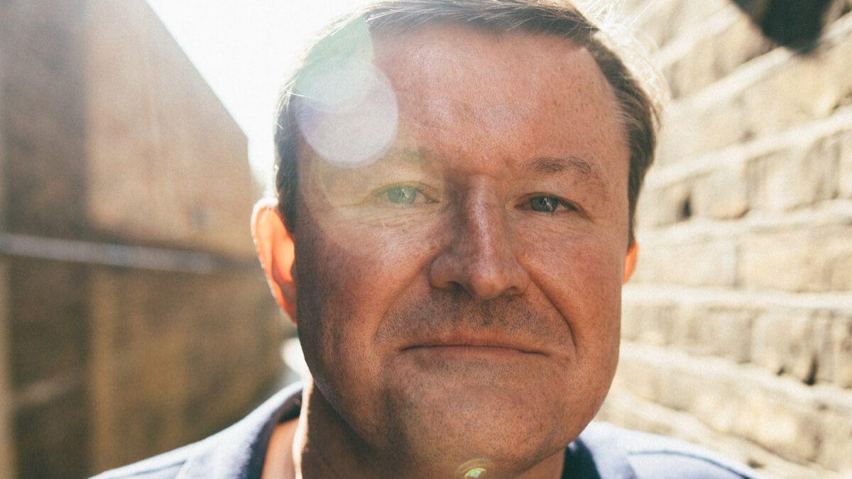 Close up of man outside in the sun looking into camera
