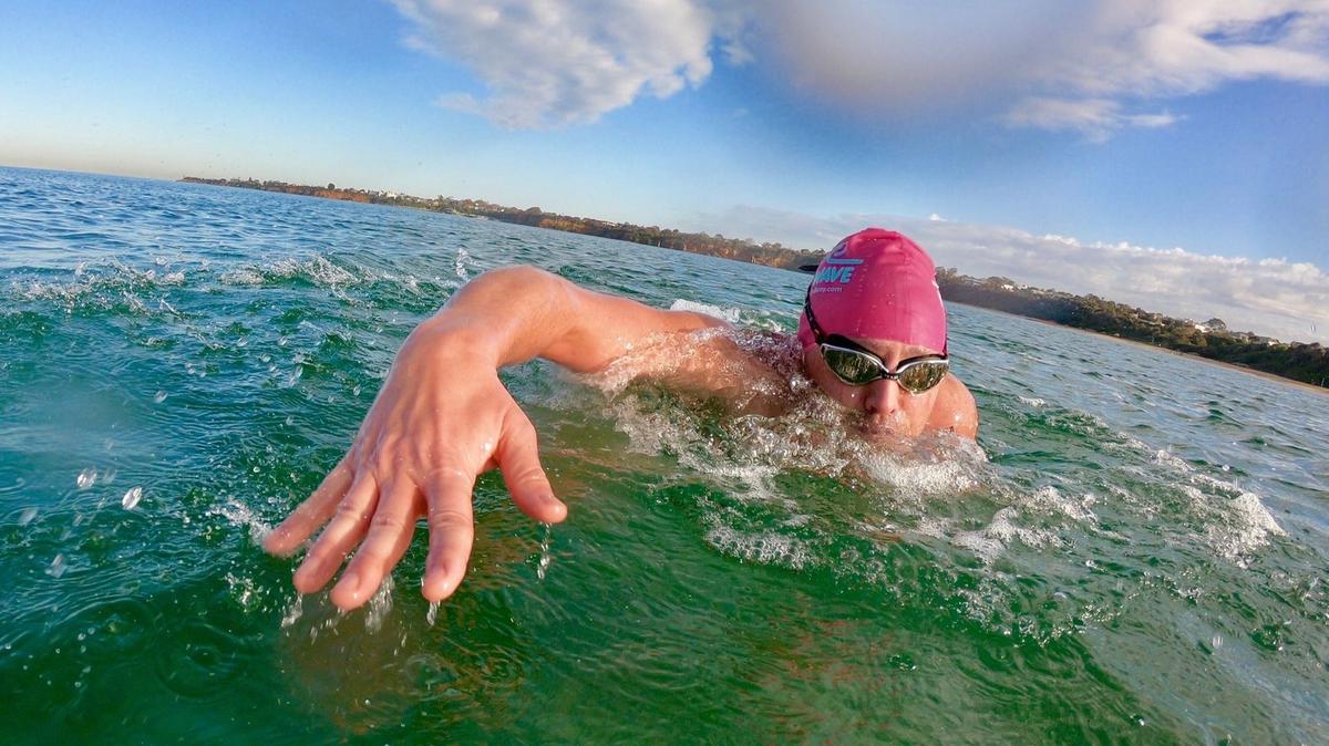 Luke Richards swimming in the ocean