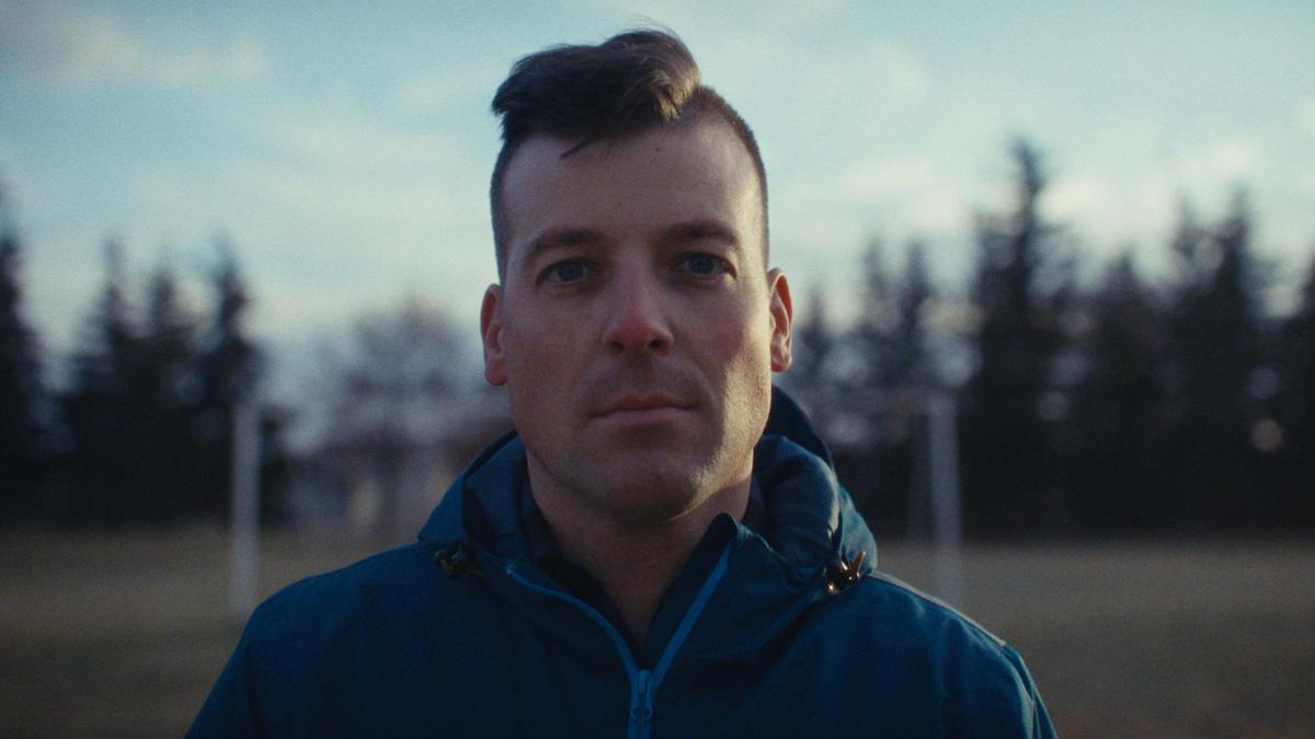 Pensive man stares into the camera's lens for a photo
