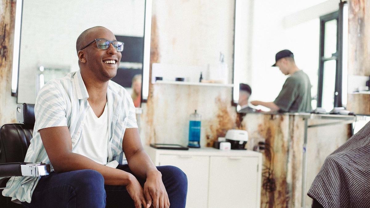 Man laughing at barbershop