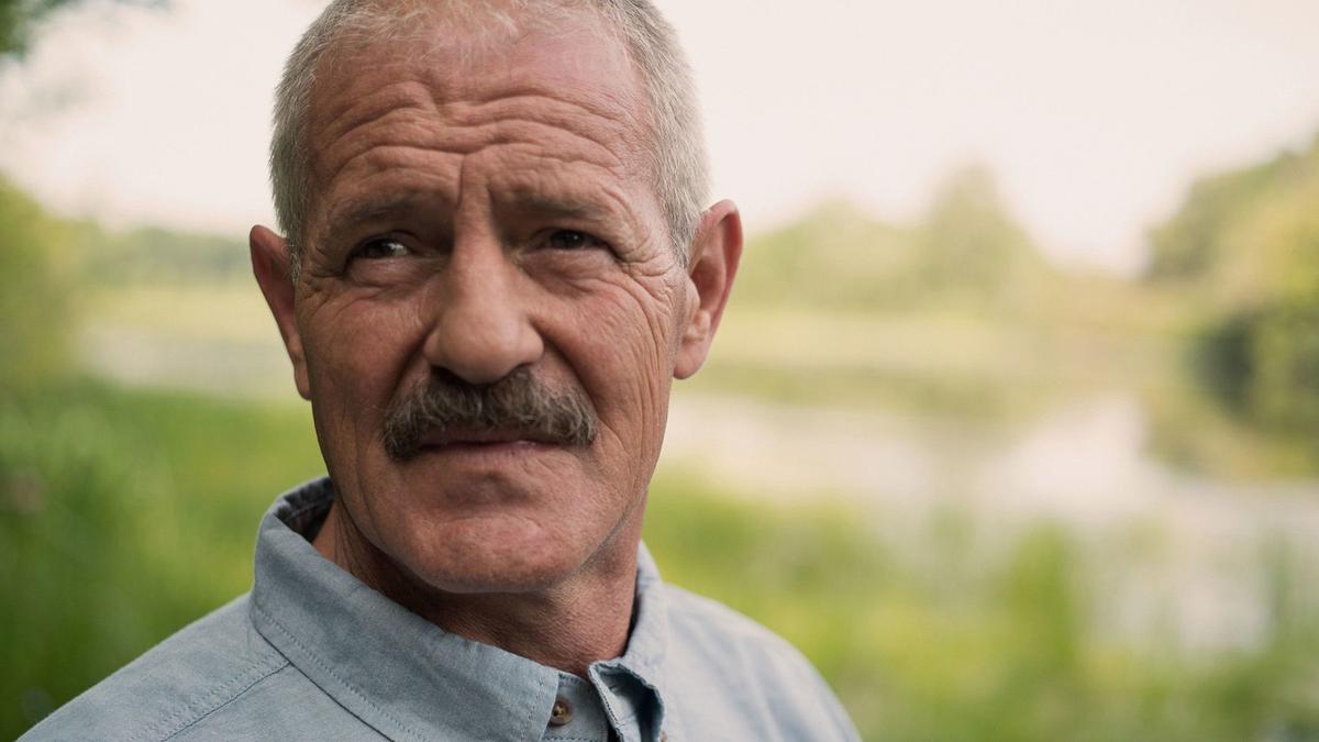 Middle-aged man looking to camera.