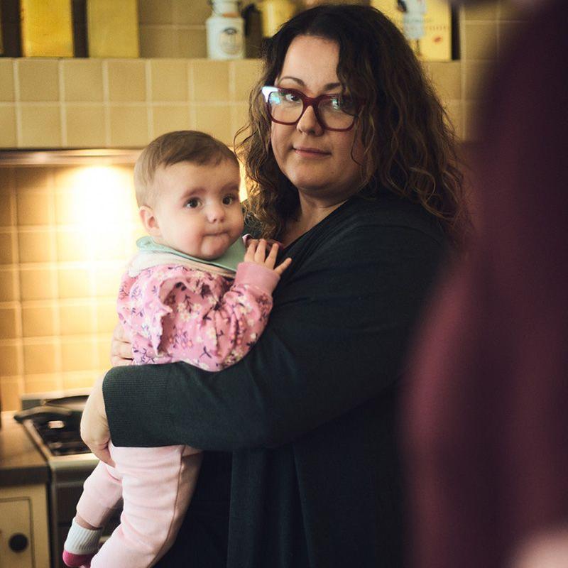 Photo of a mother holding a child.