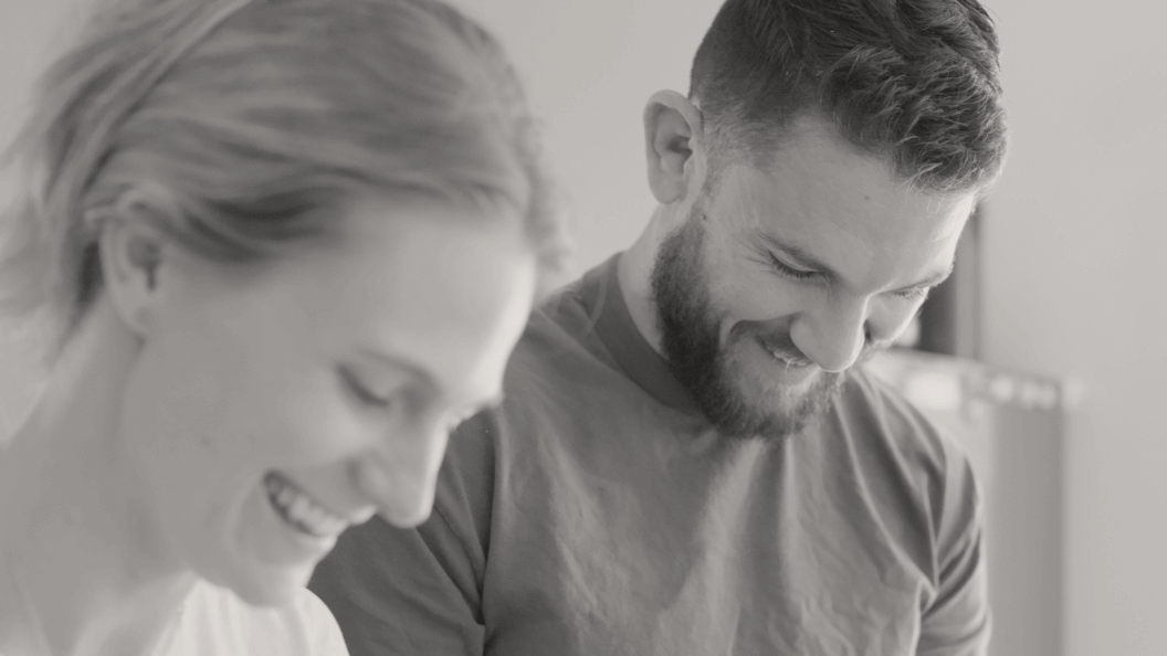 Woman and man enjoying working in the kitchen together