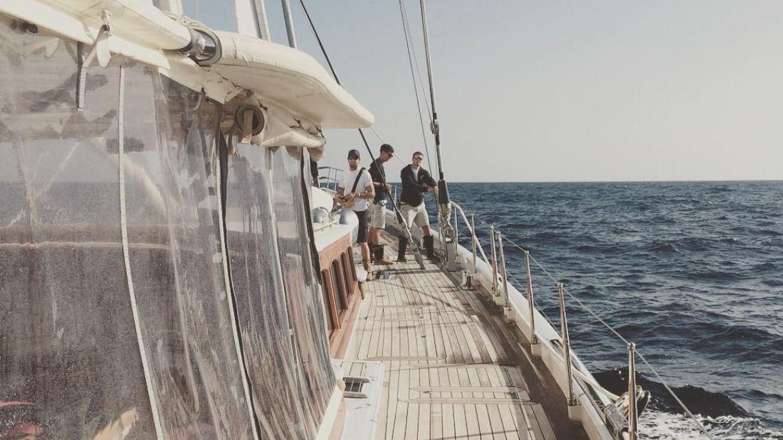 Candid picture of Alastair on a sailing boat at sea