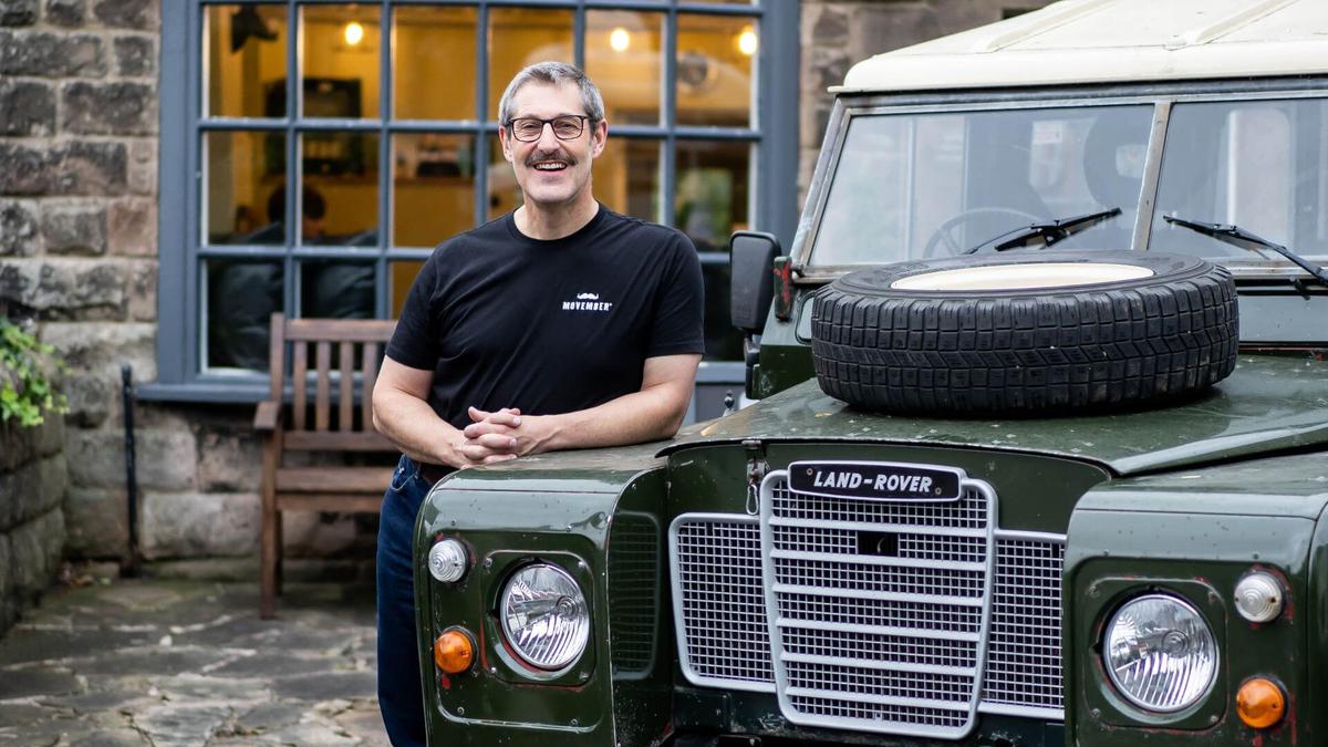 Man next to a Land Rover