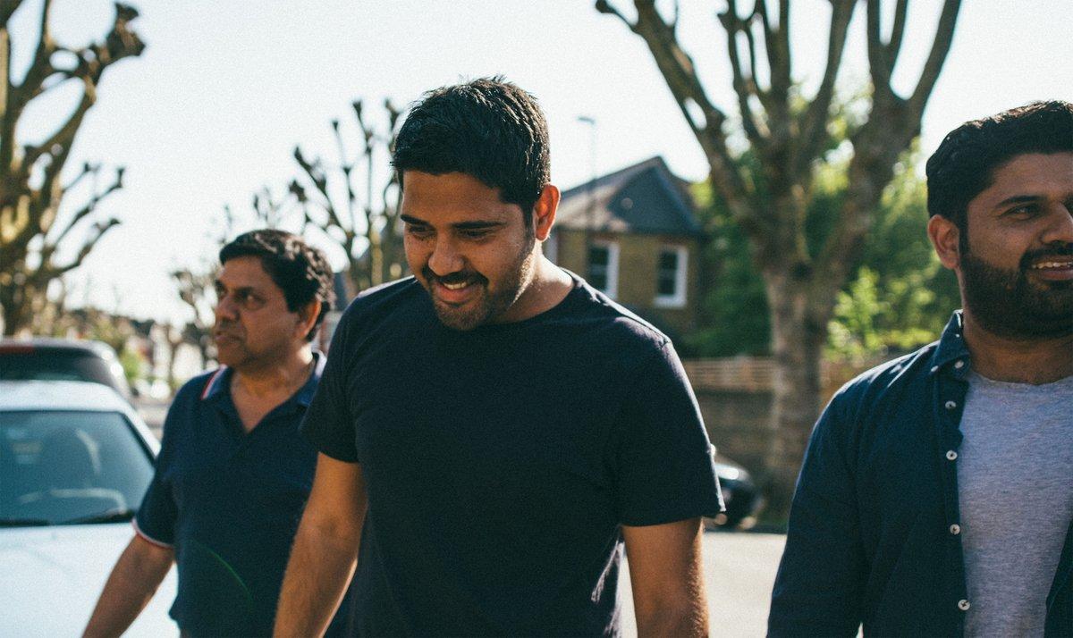 Three men walking down the street