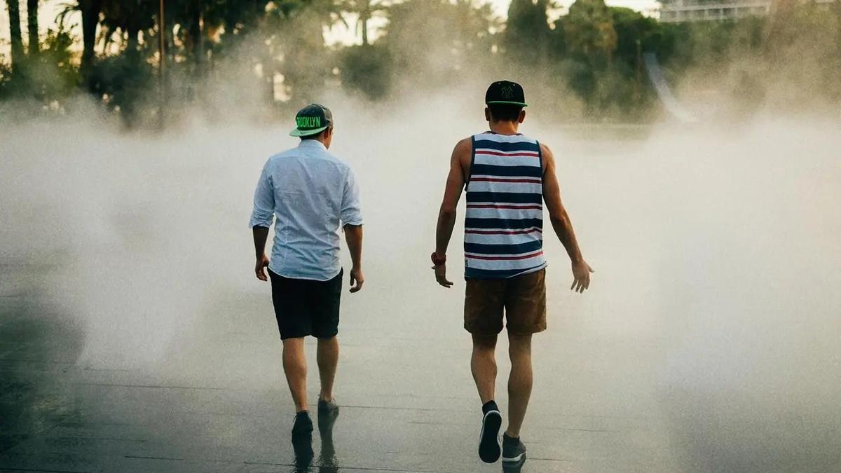 2 boys walking together outside