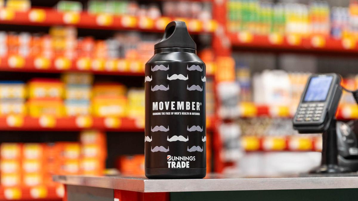 Moustache patterned drink bottle on top of counter