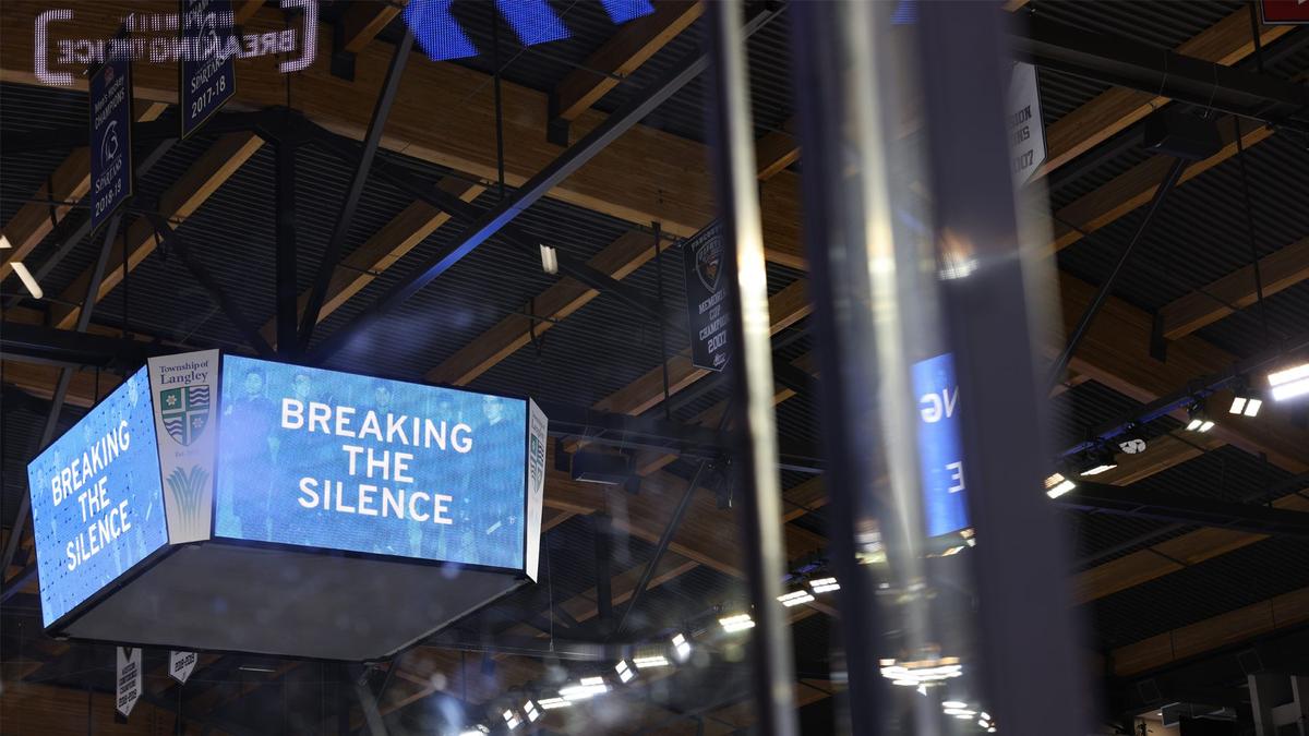 A jumbotron with blue screen and text that says "Breaking the Silence" which was at the WHL prospects game.