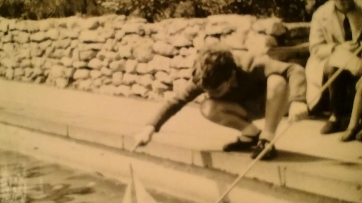 boy playing with boat