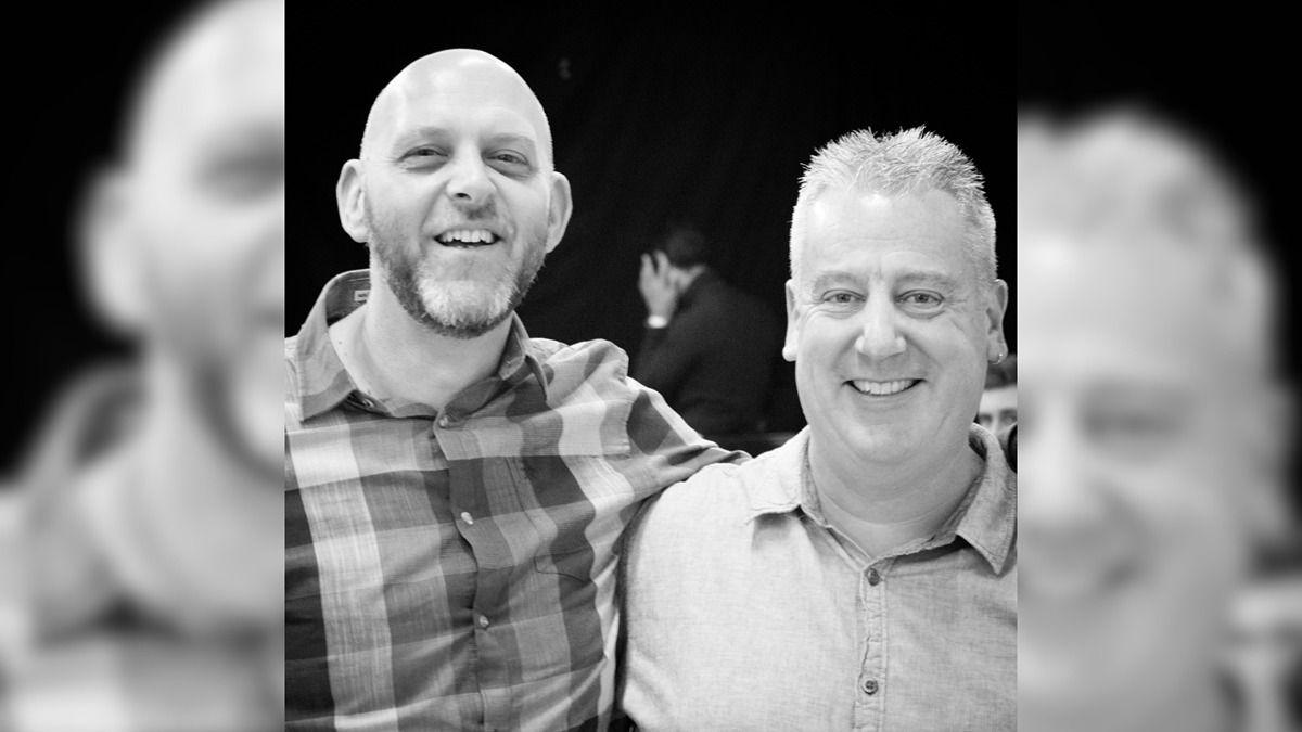Black and white photo of Paul and his friend, Richard, smiling 