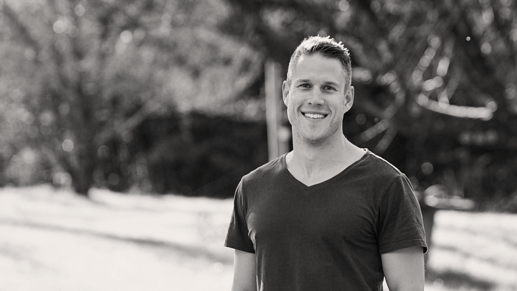 Man smiling in park