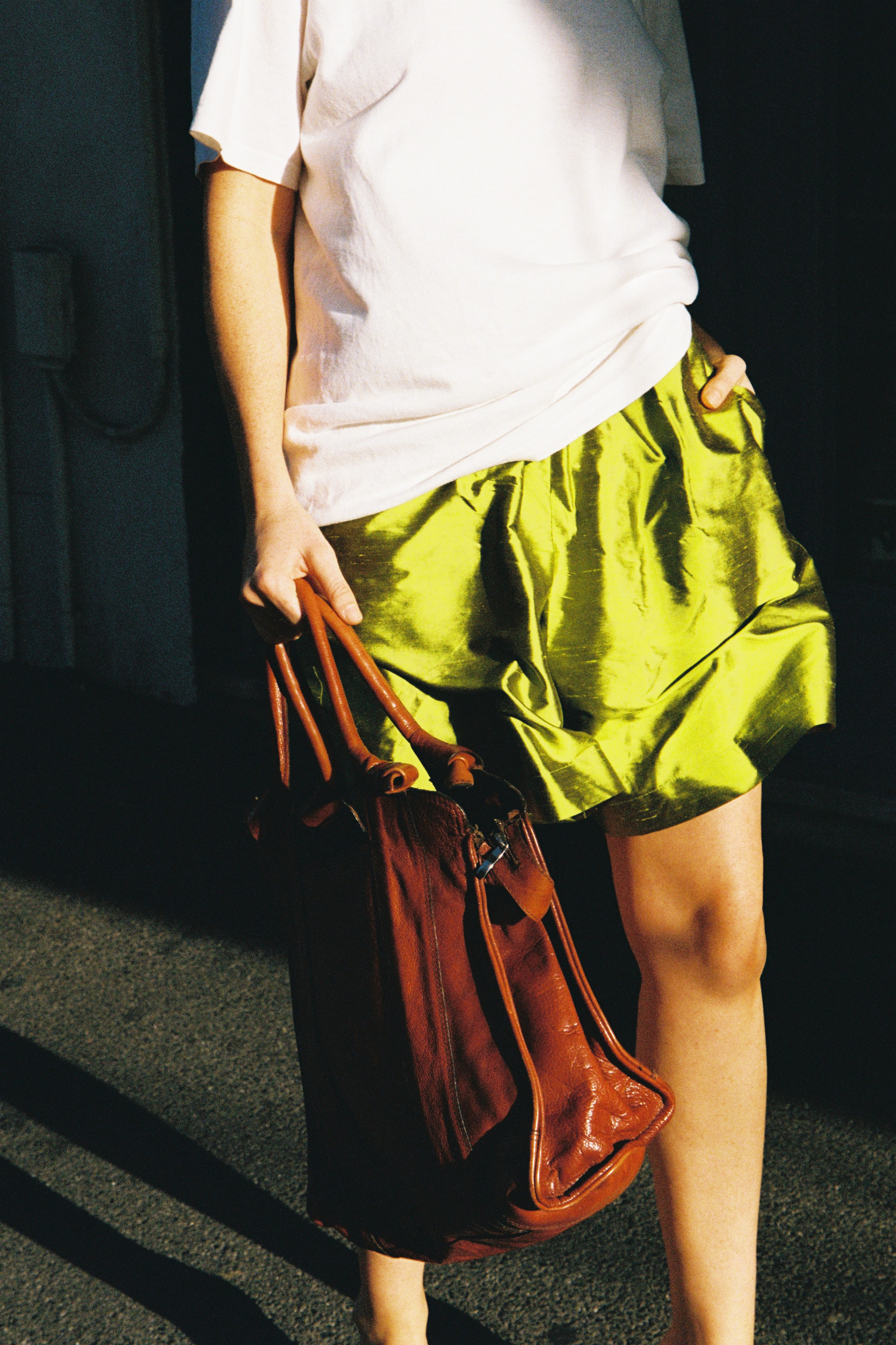 Model wearing vibrant chartreuse Delphine shorts