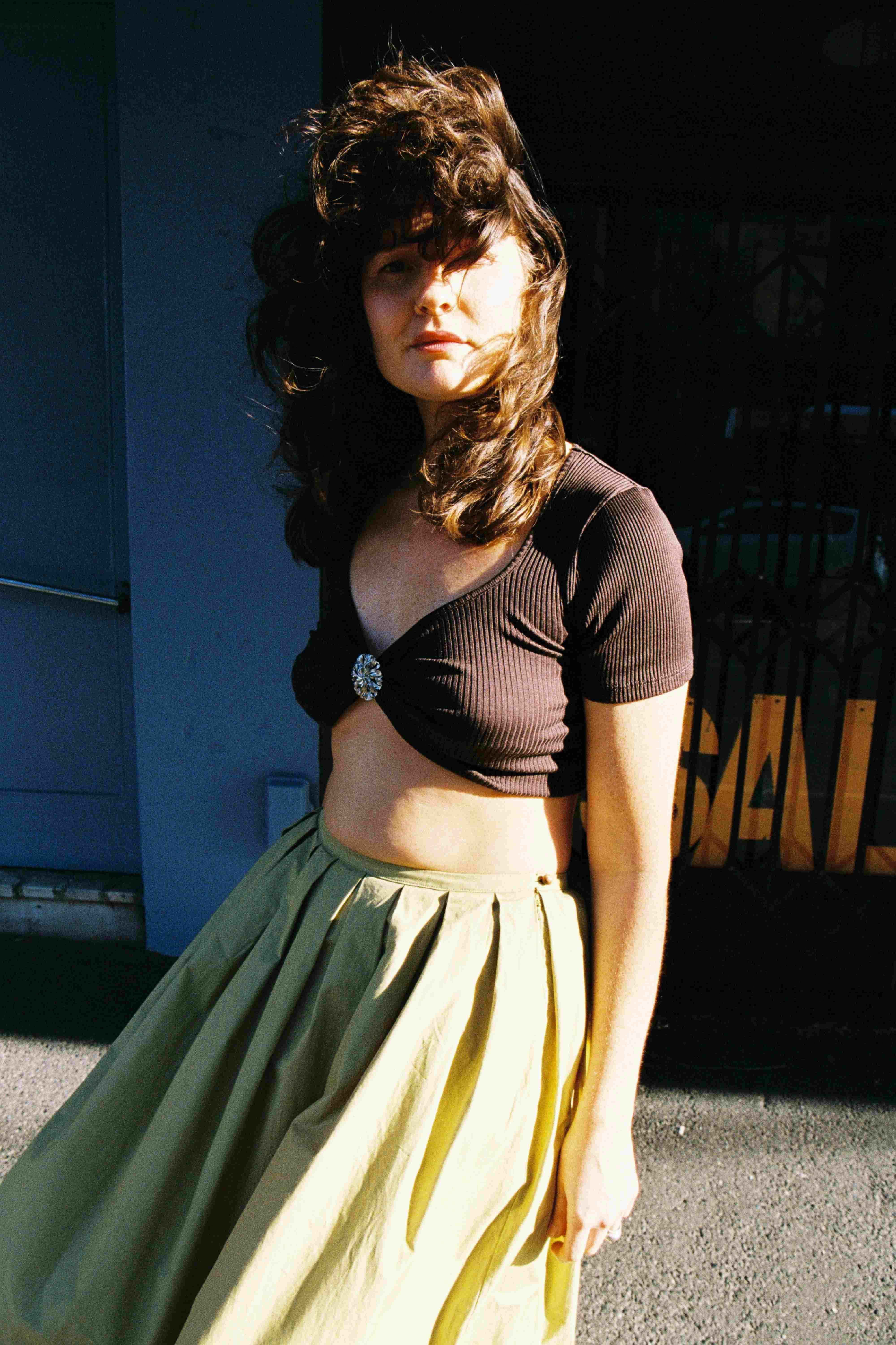 Model wearing fennel Passenger skirt and cocoa Swan tee