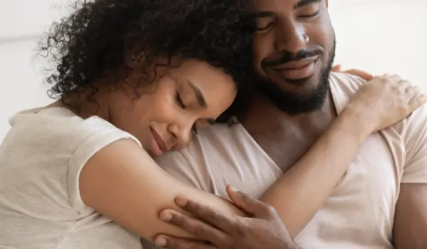 woman and man embracing