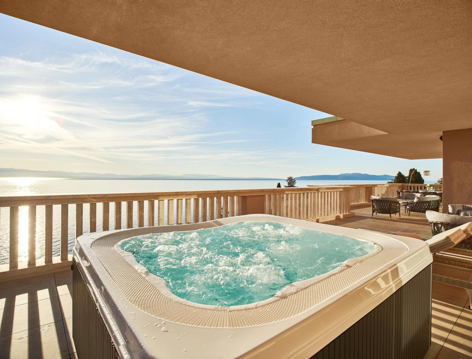 A balcony jacuzzi above the bay