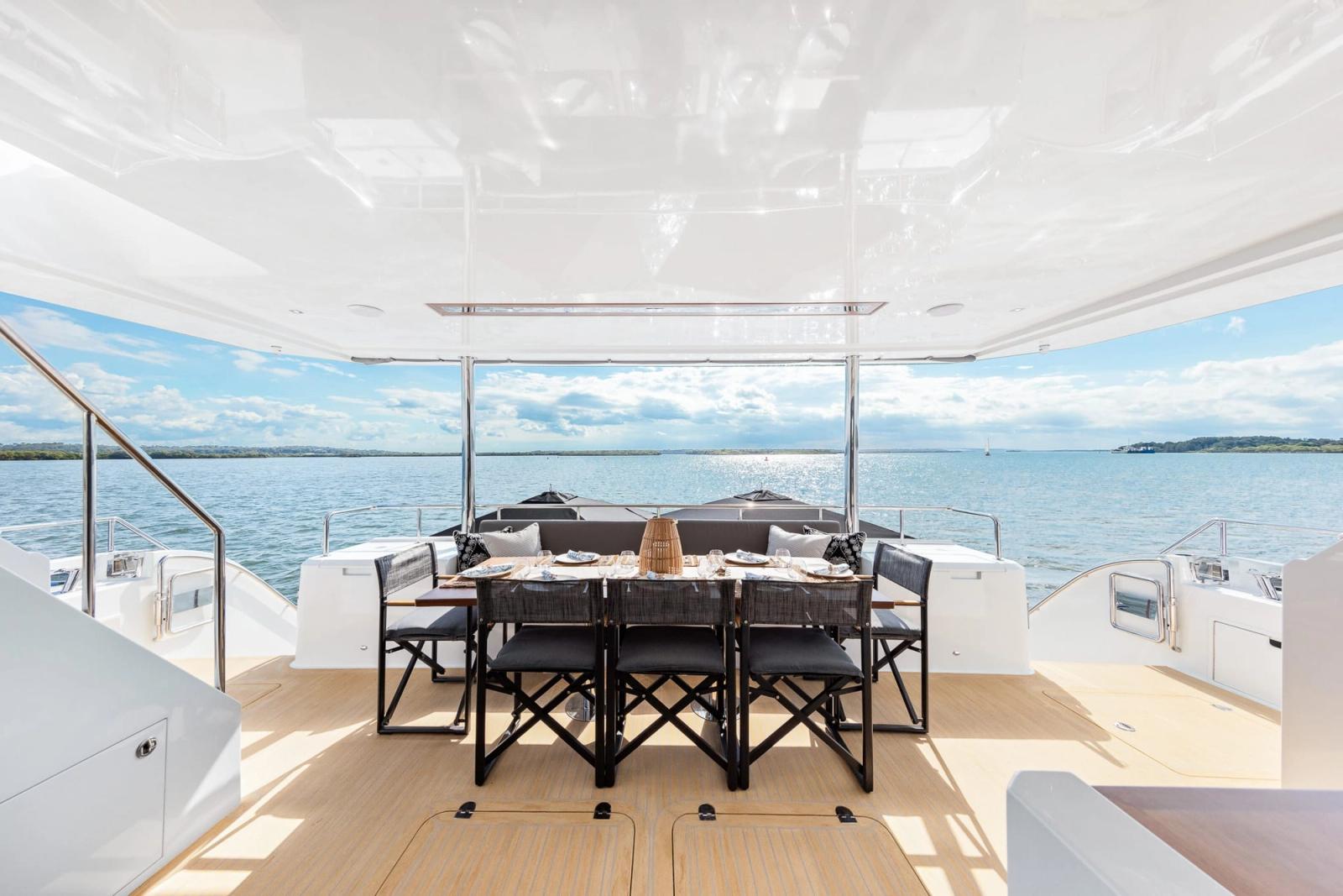 The aft deck set for lunch as the yacht lies off the islands.