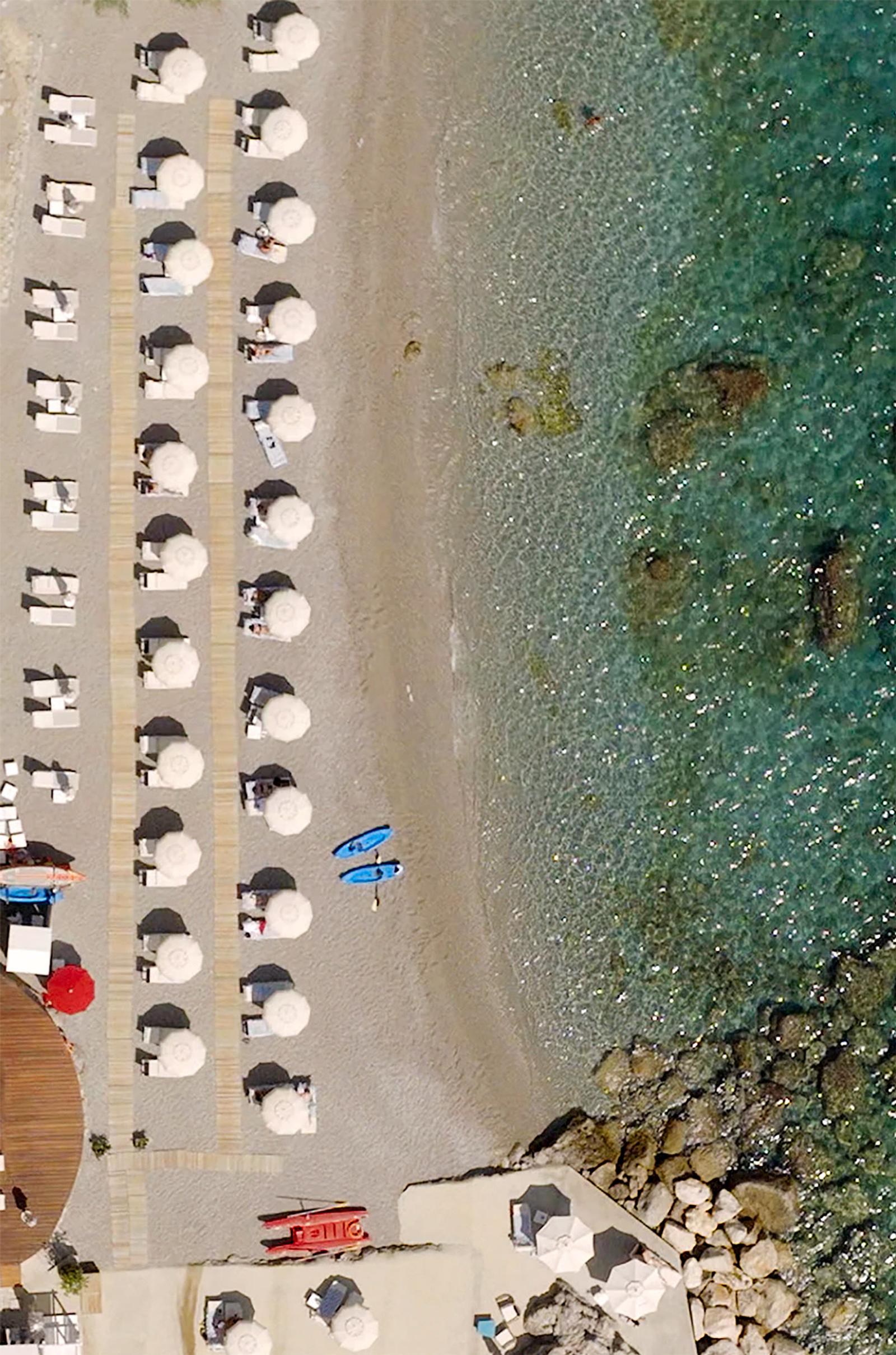 Aerial of the terraced pools and beach club at Borgo Santandrea