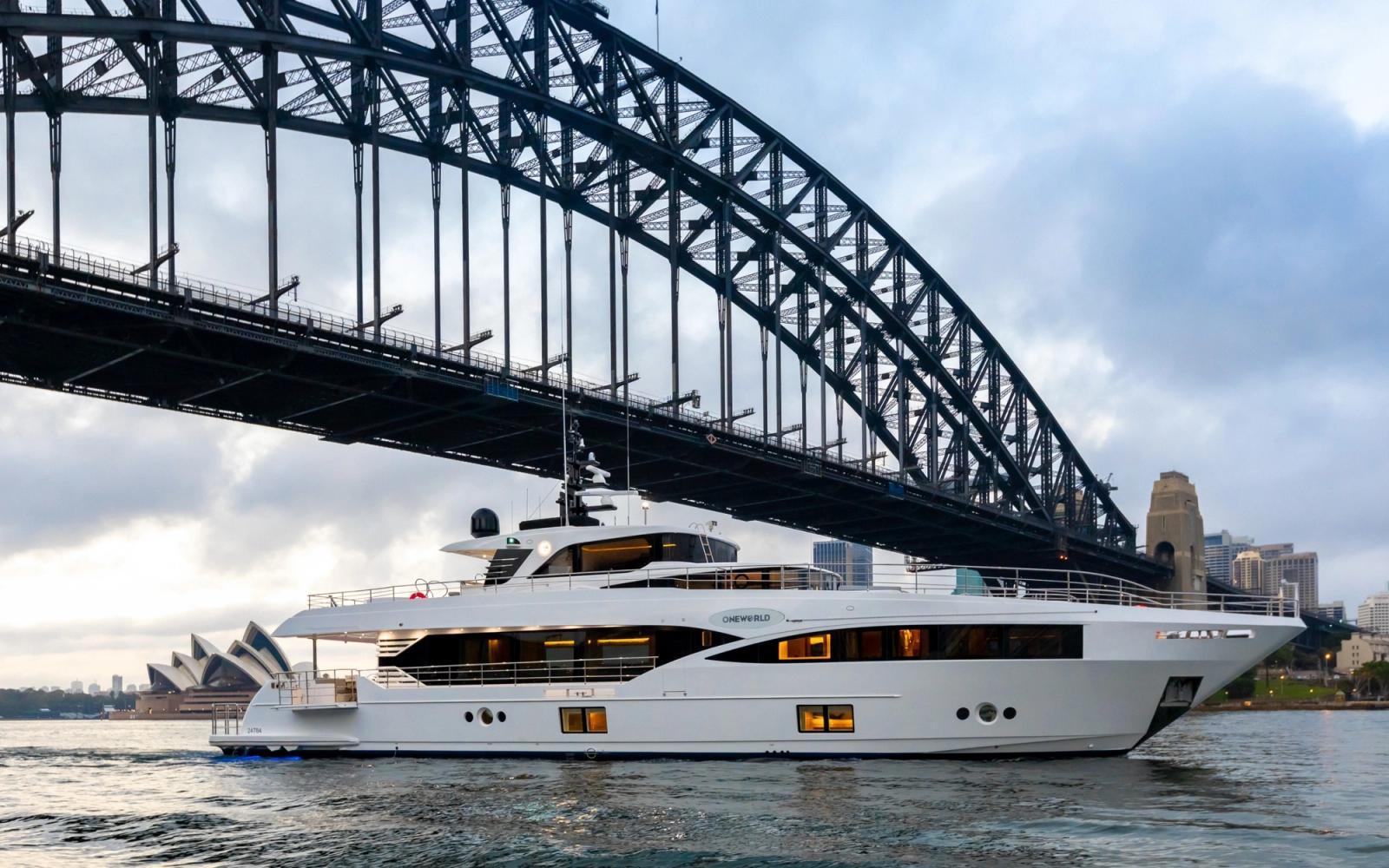 ONEWORLD passing beneath the Sydney Harbour Bridge